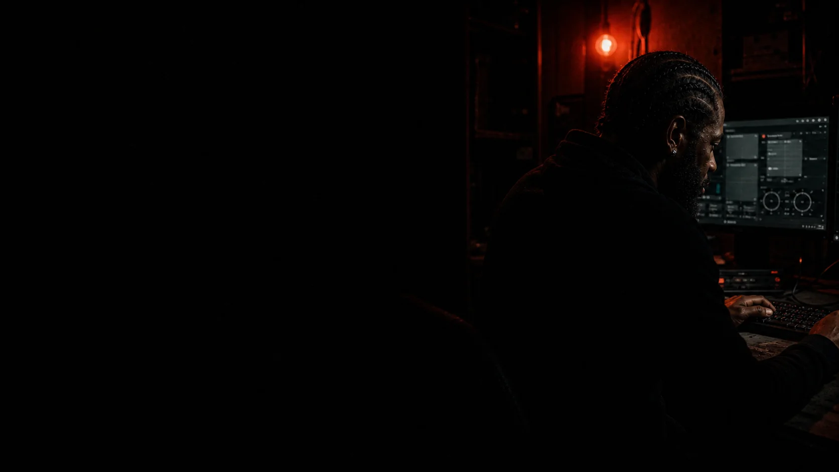Backroom Software founder working alone in a home studio at night
